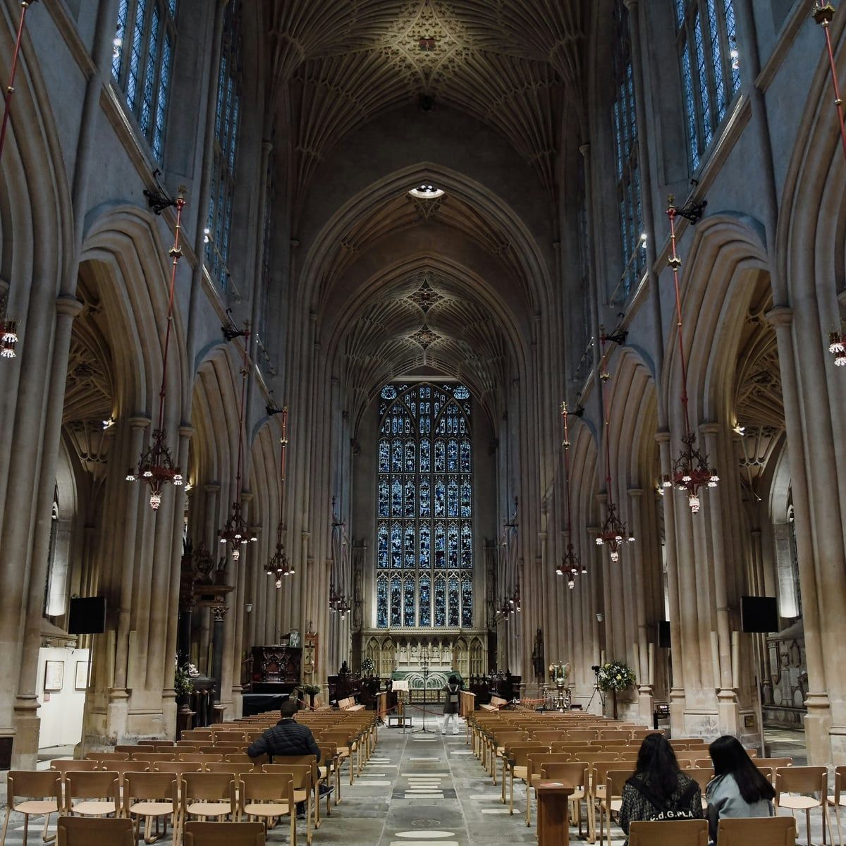 The nave of Bath Abbey under its fan-vaulted ceiling, the great east window at the far end