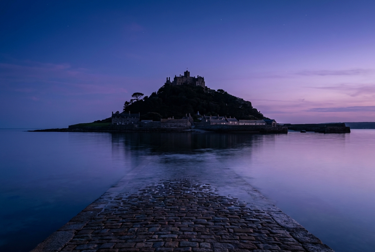 St Michael's Mount at dusk, the granite causeway running across the water to the castle on its island
