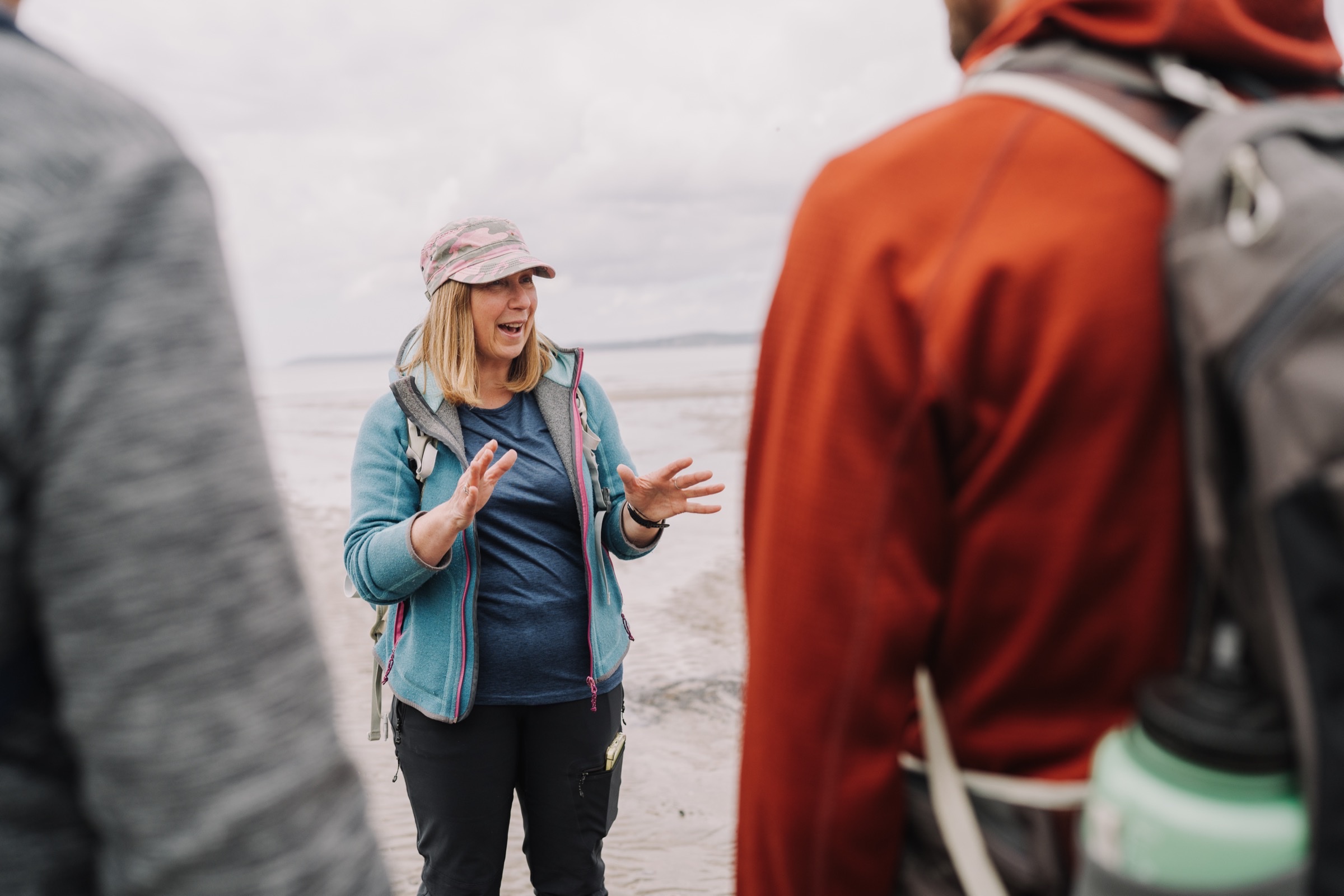 A small group of guests walking a coastal path